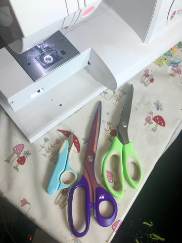 Three pairs of scissors for sewing