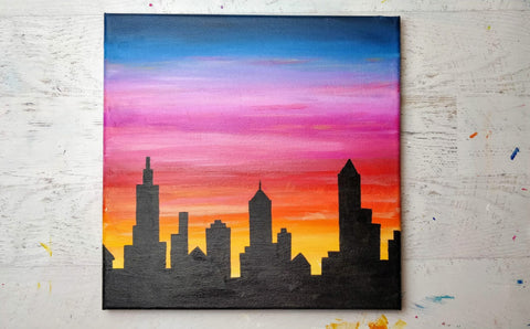 Comment peindre un paysage urbain au coucher du soleil?