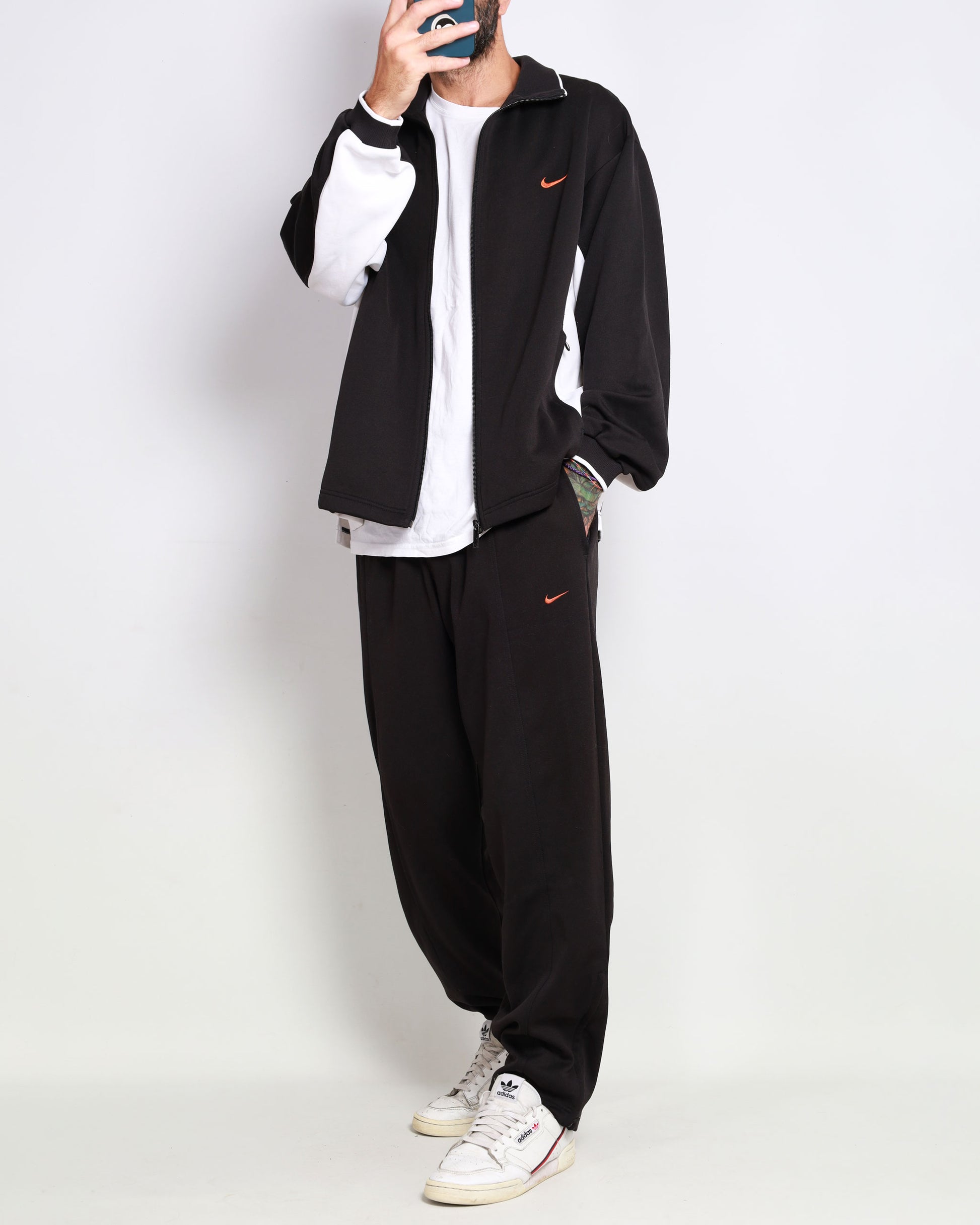 Order NIKE Solo Swoosh Woven Track Pant black/white Pants from