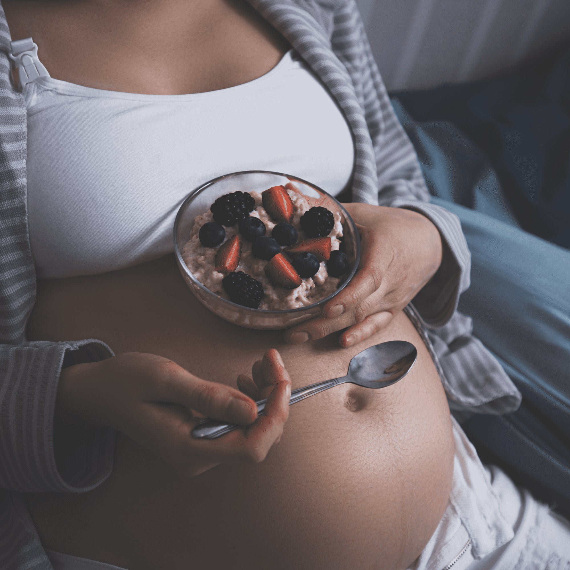 two-pregnant-women-raising-hands