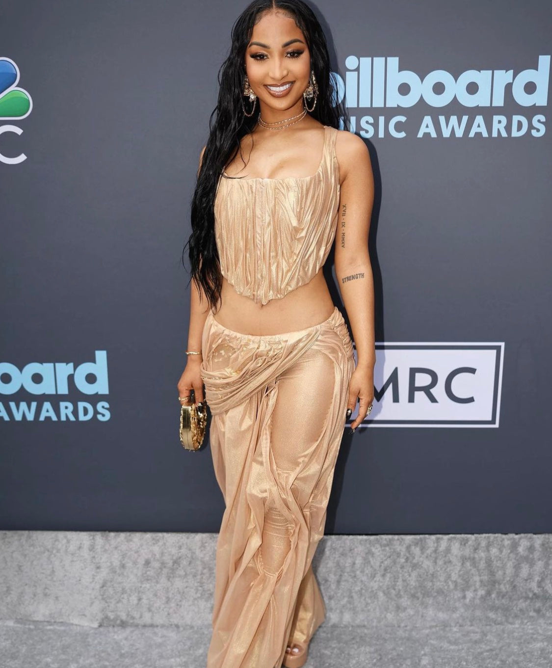 Shenseea Billboard Music Awards clutching Blumera Simurgh and Hummingbirds ushape Mini brass clutch