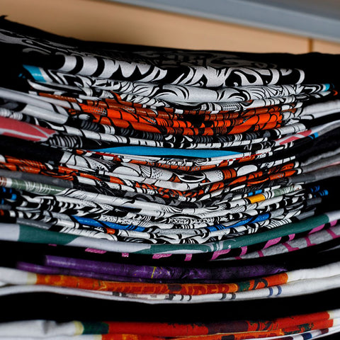 stack of custom printed t shirts