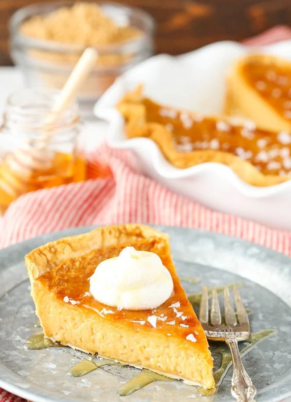 honey salted pie with honey dipper in the background