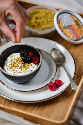 Elias Honey Bee Pollen being sprinkled over yogurt