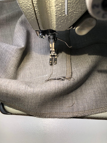 Sewing trousers in studio