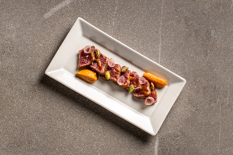 Iberian pork tataki, pistachios, pickled onions and sweet potato puree