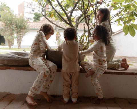 A group of kids wearing pajama at a mediterranean house
