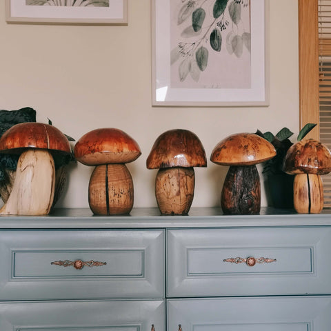 goblincore decor presenting wood mushroom sculptures