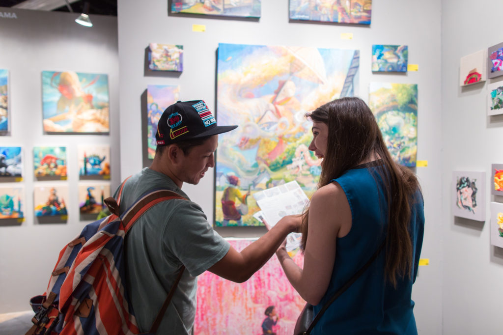 fairgoers at a past rendition of the SuperFine Art Fair