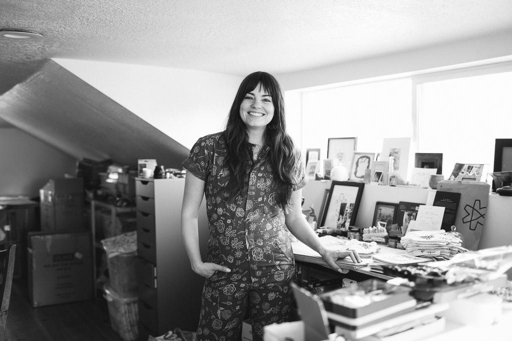 Black and white photo of artist, Michelle Christensen in her studio