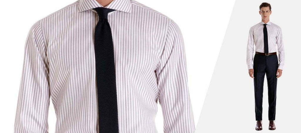 camisa a rayas y corbata lisa en un hombre
