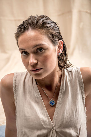 Model wearing turquoise earrings & necklace