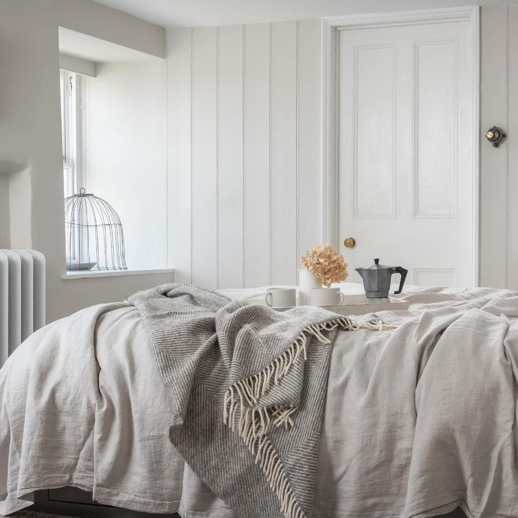 A beautiful coastal bedroom interior with neutral colours