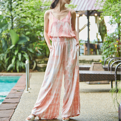 Women standing while wearing matching batik top and pants by Batik Boutique in design shibori terracota