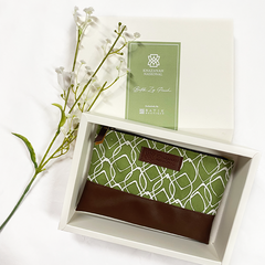 A captivating photo showcasing custom corporate gifts crafted with genuine batik, forming a distinctive zip pouch, set against a pristine white background