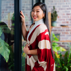 a woman in an elegant crimson rose kimono