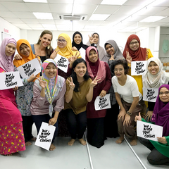 a group photo of all the seamstresses