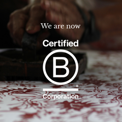 a picture of an artisan blocking authentic batik with the certification b corporation