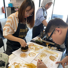 a group of corporate clients making their own batik and blocking their own designs
