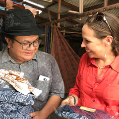 a picture of a batik artisan, aznan, together with the owner and ceo of batik boutique, amy blair
