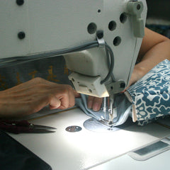 artisan sewing batik zip puch