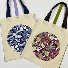 a collective photos of the durian tote bags in both maroon and navy showcased in front of a neutral background