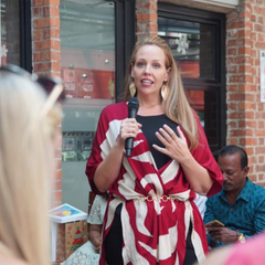 amy blair, ceo and founder of batik boutique giving a talk at an event