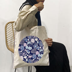 a model showcasing a durian tote bag in the color navy