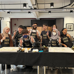 a group photo as the group gets ready to make their own batik designs