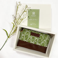 a photo of a corporate order with authentic batik and presented in a white bA visually appealing photo showcasing a corporate order featuring authentic batik, elegantly presented in a white box for a sophisticated and professional touch