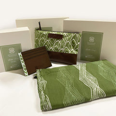 a batik gift set for khazanah national against a neutral background complete with batik zip pouch, batik wallet card holder and other batik products