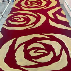 an authentic batik being displayed in the vibrant pattern crimson rose