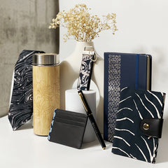 A captivating photo featuring an array of batik and batik-inspired items ideal for corporate gifting, elegantly presented against a neutral background