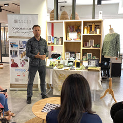 a speaker explaining the benefits of supporting authentic batik in batik boutique