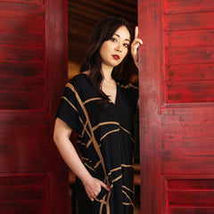 batik boutique batik dress in black ecru lifestyle door