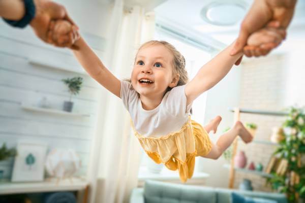 Parent playing with kid in their room