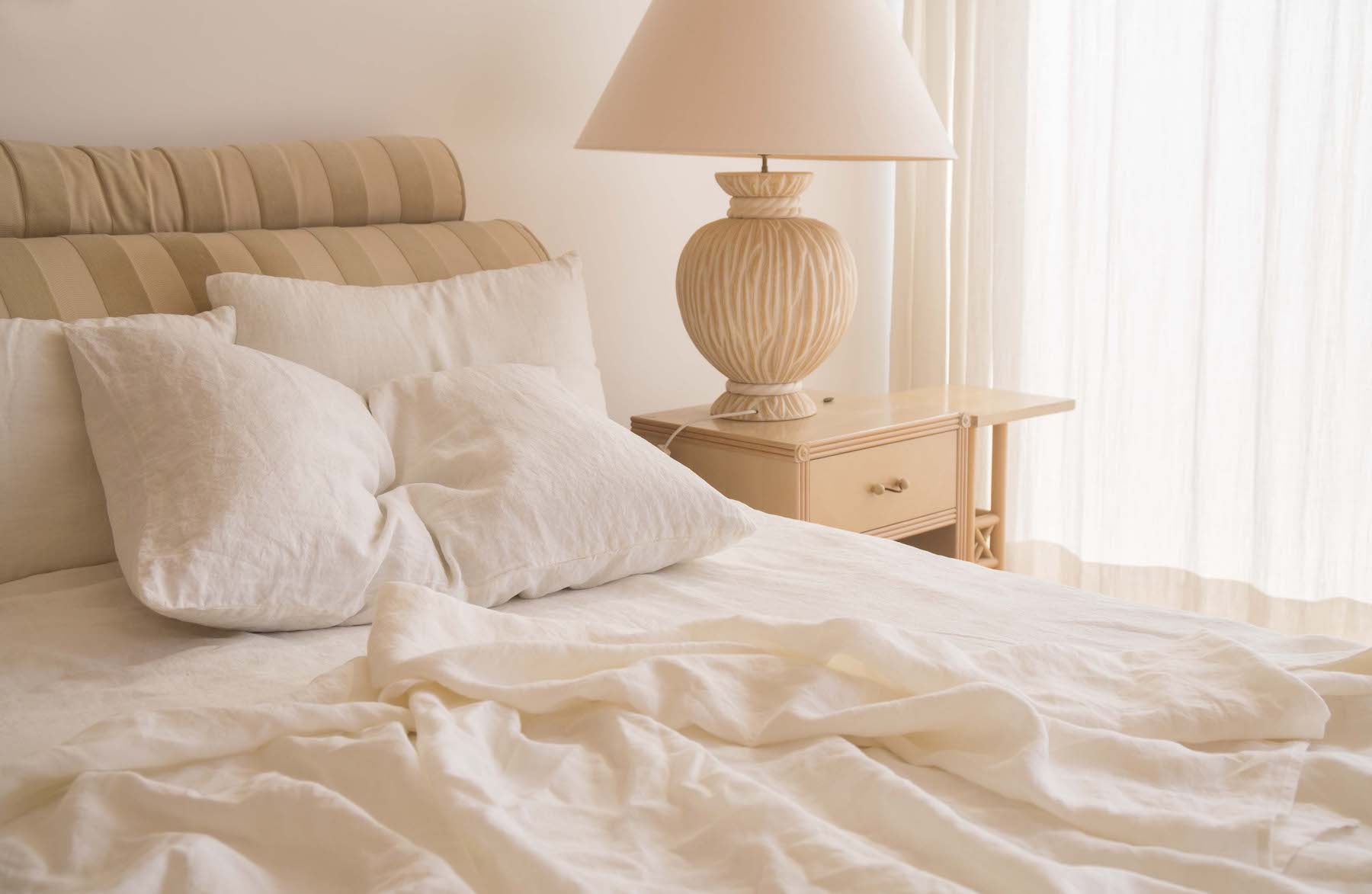 White linen bedding in sunlit bedroom, off white aesthetic interior design - Lagodie Linen.jpg