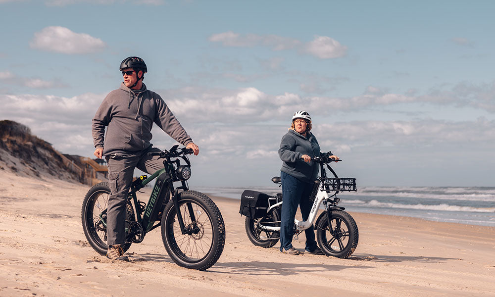 Elders are riding Heybike fat tire e-bikes on the beach