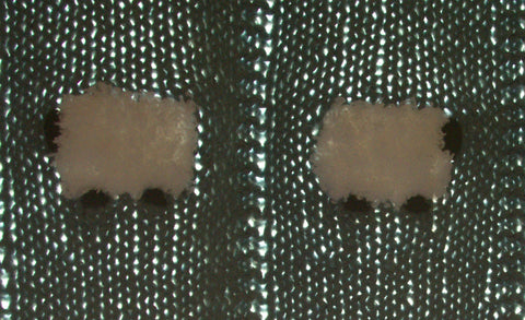 Closeup of cells in a hand-knitted blanket, a very breathable baby blanket (cellular blanket)