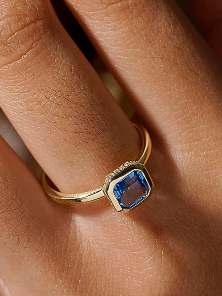 Rings with radiant cut stones sapphire tone and zircons