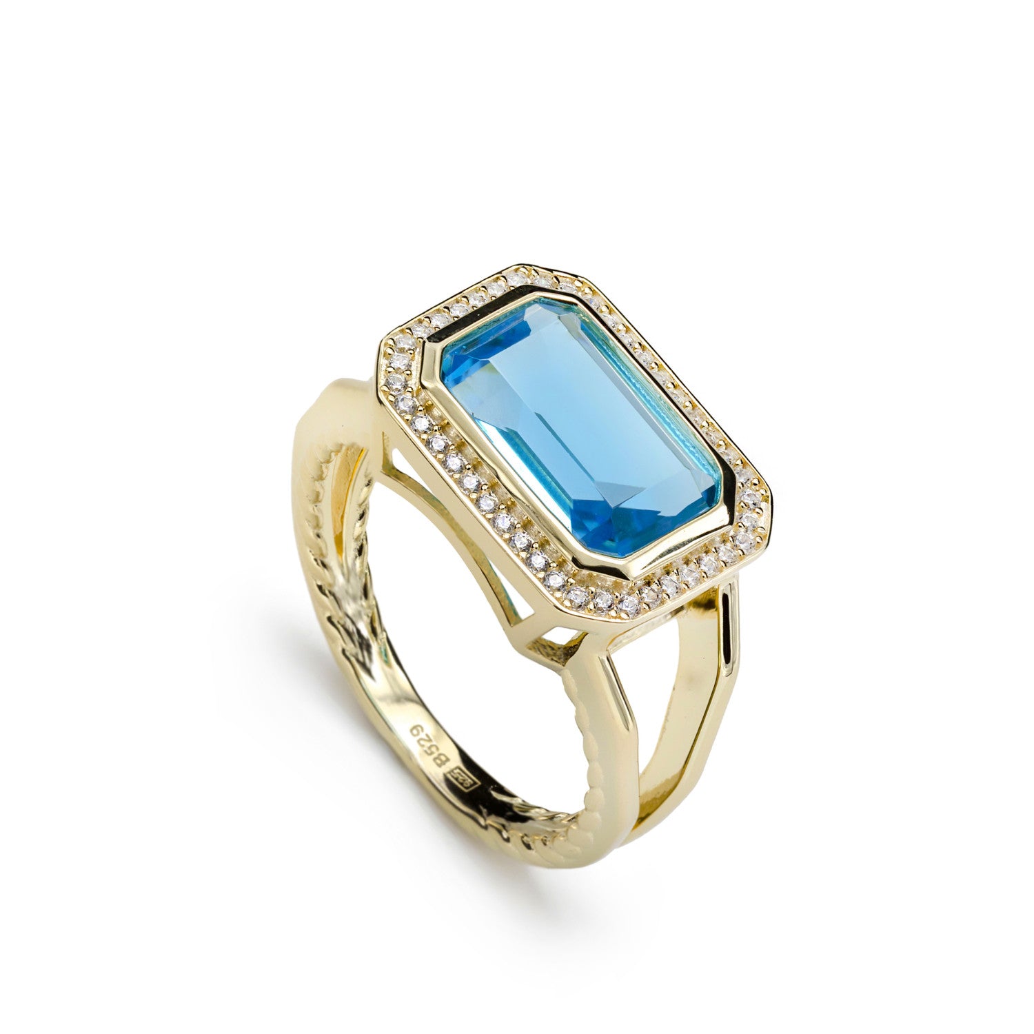 Gemstone rings with emerald-cut gemstone in aquamarine tone