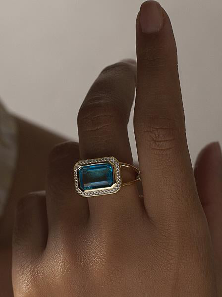 Gemstone rings with emerald-cut gemstone in aquamarine tone