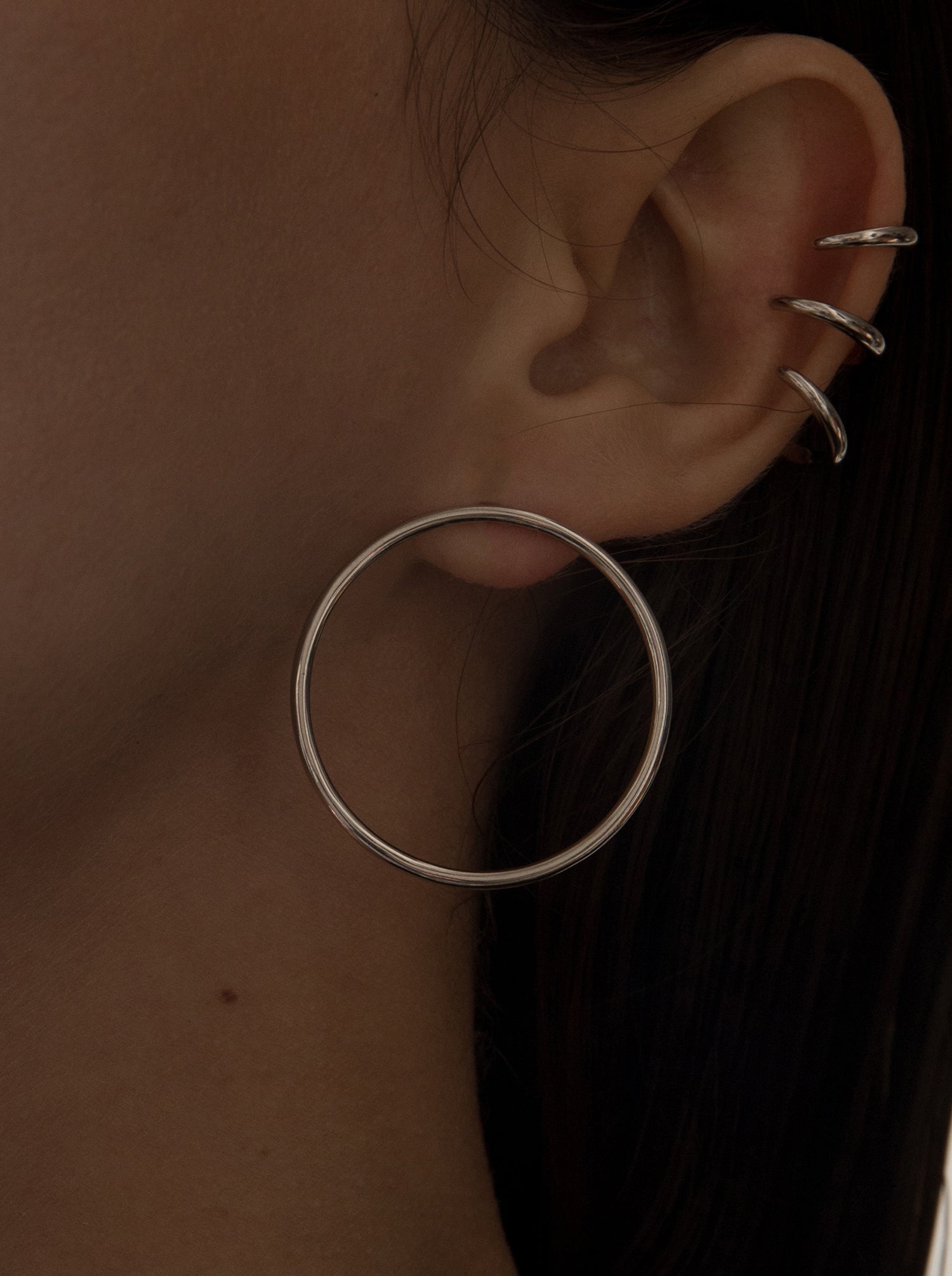 Silver hoop earrings circular design