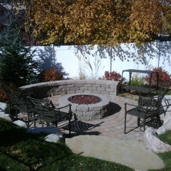 Backyard firepit surrounded by patio