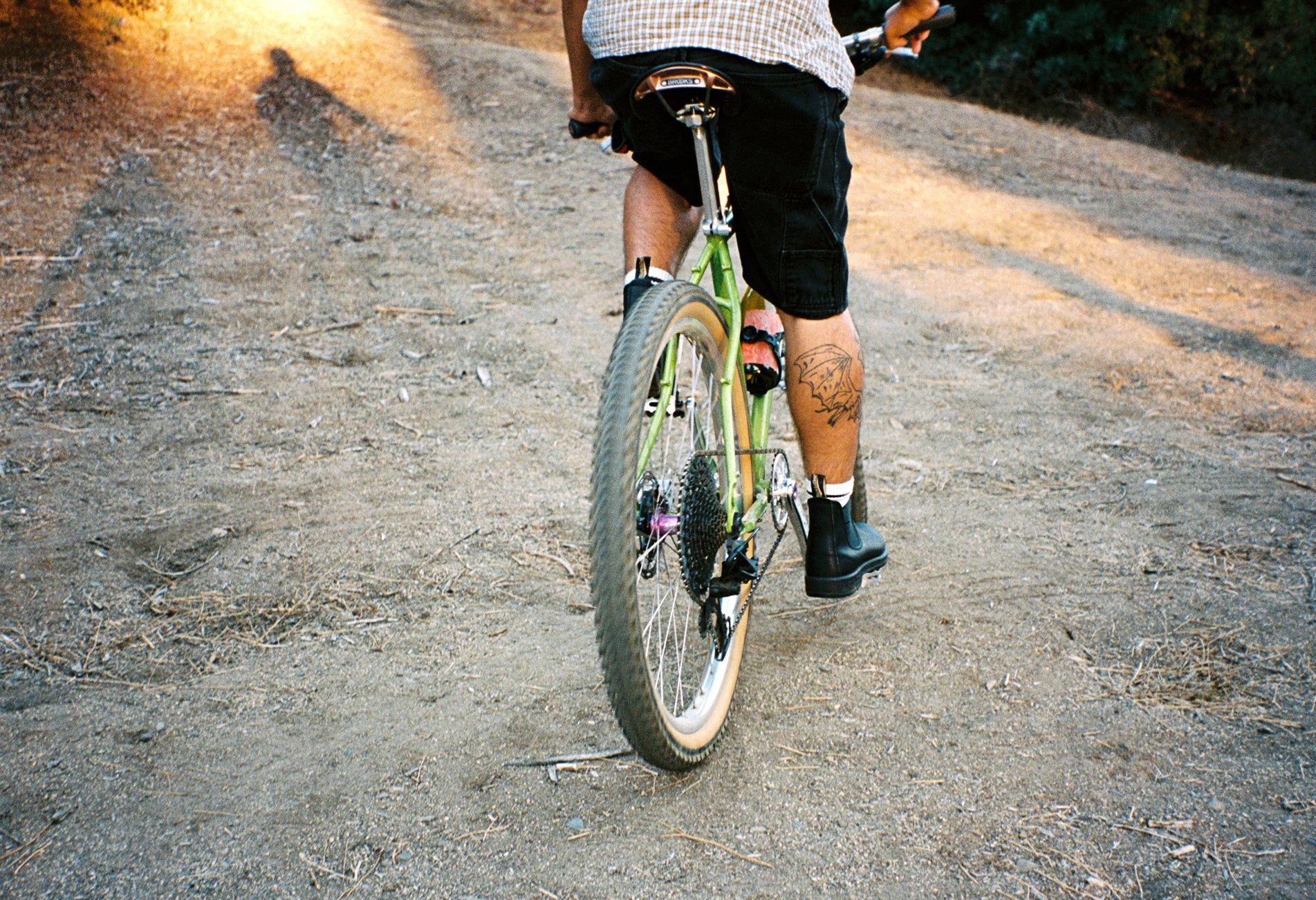 Martha Stoumen Wines Trailblazer Bundle wine Solo Act as seen on a bicyclist climbing up a trail.