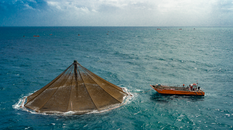 A fish farm and a boat.