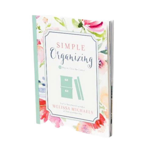 Simply Organizing book with pastel floral cover.