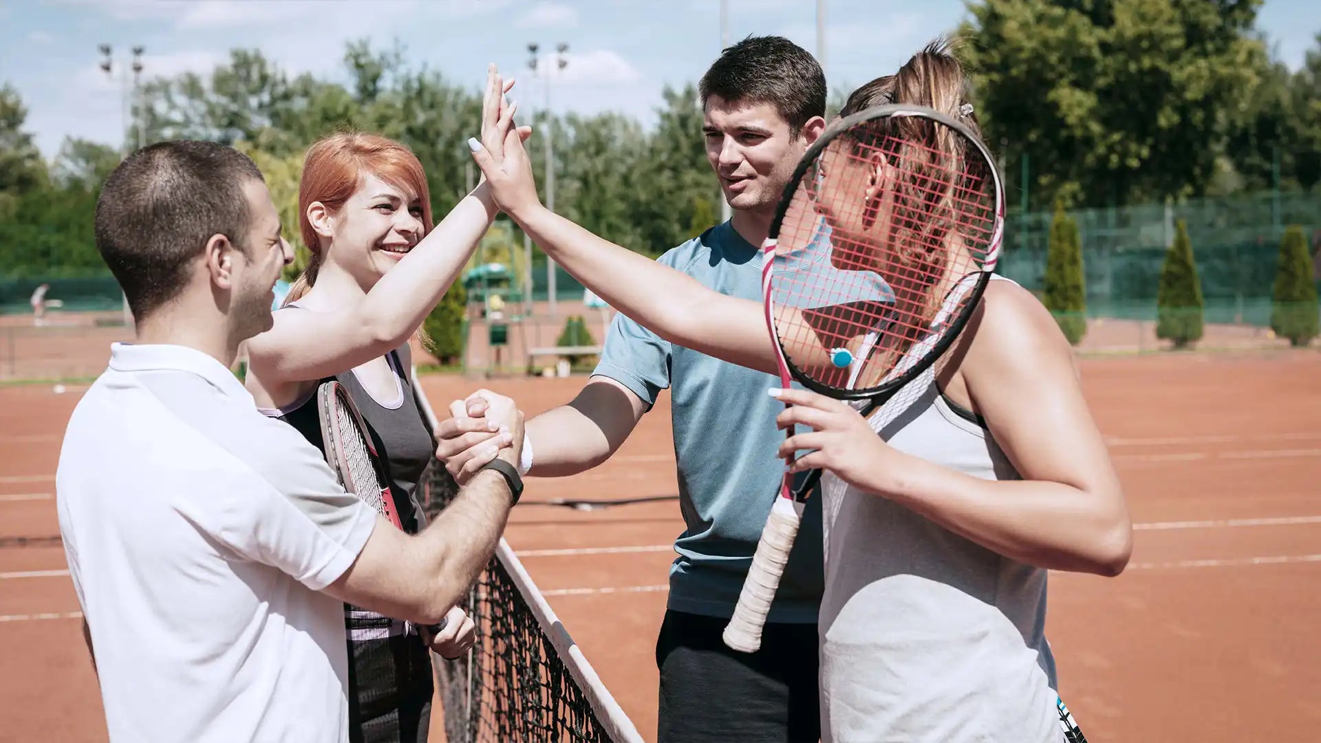 Tennis players greeting each other after a tennis match