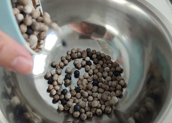 Pour contents of mineral pellets into a bowl