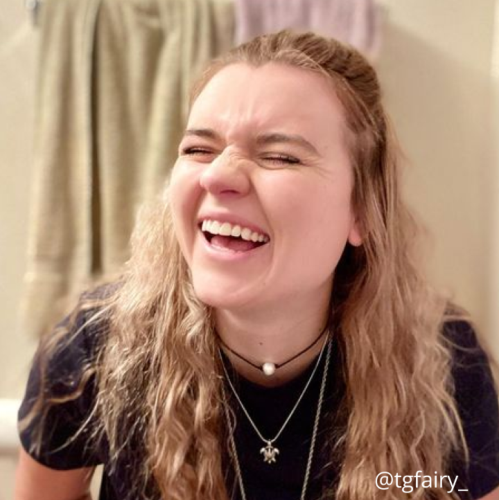 A woman smiling, in reaction to her using a LUXE Bidet for the first time